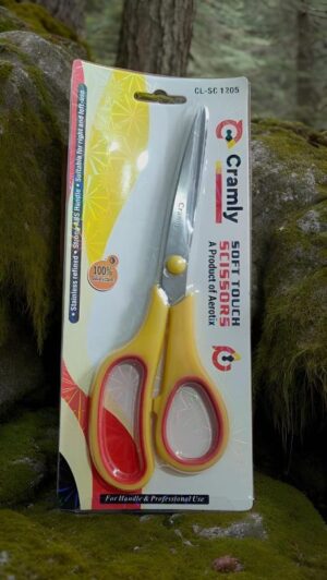 Packaging for yellow-handled scissors with red trim labeled 'Soft Touch Scissors' on mossy rocks.