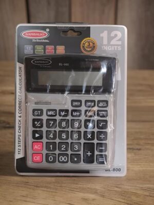 Calculator in blister packaging showing a 12-digit model with gray and black keypad and a large LCD display.
