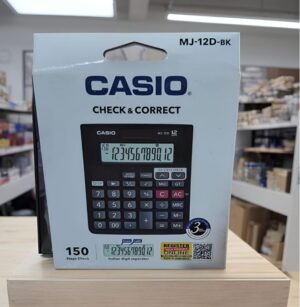 Casio calculator packaging on a light blue box with 'CHECK & CORRECT' and a photo of the calculator on the front, set on a wooden display shelf.