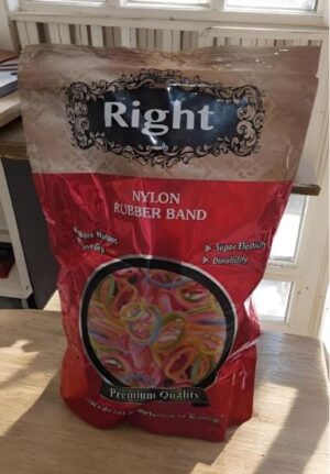 Bag of Right nylon rubber bands in a red-beige package on a table; window shows a circle of colorful rubber bands inside.