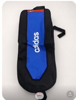 Black Adidas gym bag with a blue center panel, white logo, red zipper, top handle and a side mesh pocket.