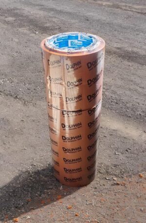 Brown Dolphin self-adhesive tape roll standing upright on a gravel surface, with a blue inner core visible.