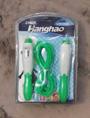Langhao jump rope in clear blister packaging with green and white handles and a green rope on sandy ground.