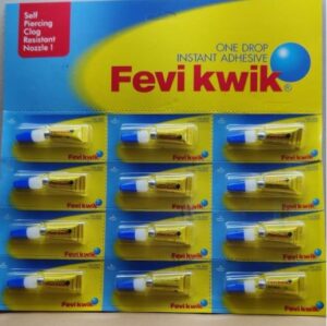 Packaging display of Fevi Kwik instant adhesive with twelve yellow tubes and blue caps on a bright blue-yellow backing.