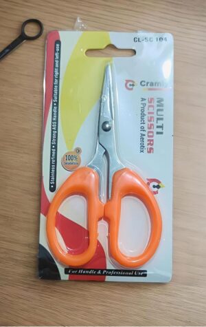 Orange-handled scissors in clear blister-pack packaging with metal blades, labeled MULTI SISSORS for professional use.