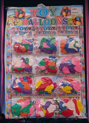 Colorful toy balloon animals in a clear display rack labeled Toy Balloons, showing assorted shapes and colors.