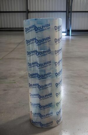 Tall roll of Dolphin self-adhesive tape standing upright on a concrete warehouse floor.