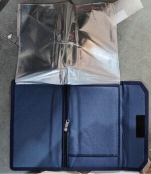 Blue zippered binder opened to reveal clear plastic sleeves for documents at the top portion and inner pockets on the bottom half.