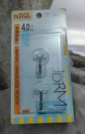 Packaging for Rimel earphones showing two earbuds in a clear plastic blister on a blue-and-yellow card with branding and Chinese text.