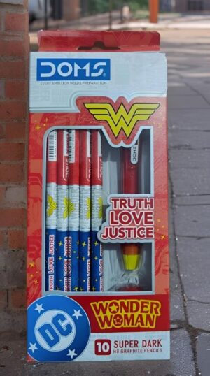 DC Comics Wonder Woman pencil set in red packaging with Truth, Love, Justice slogan and DC logo on sidewalk box display