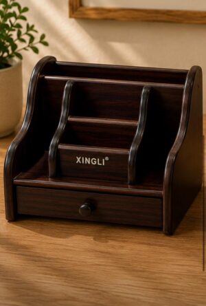 Dark wood desk organizer with curved dividers and a small drawer labeled XINGLI on a wooden surface