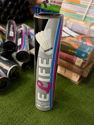 Tall cylindrical can of nylon shuttlecocks labeled 'FEEL' with a shuttlecock image on the front, standing on a green carpet in a sporting goods store
