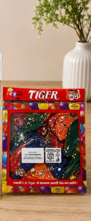 Red tiger-brand gift box with a clear window showing multicolored, confetti-pattern fabric inside; balloons and tiger image on the packaging.