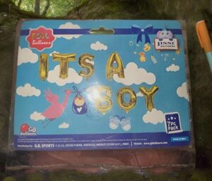 Blue sky with clouds balloon pack reading 'It's a Boy' in gold foil letters; displays stork and baby icons, 7-piece set.