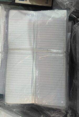 Stacks of white, lined notebook paper pads wrapped in plastic.
