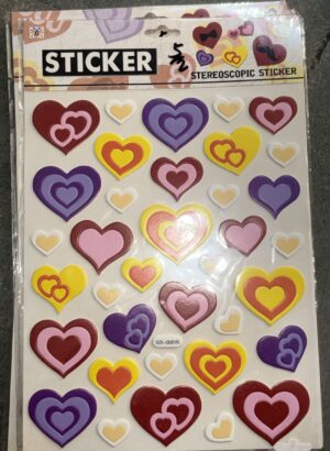 Sheet of colorful layered-heart stickers in red, pink, purple, yellow, and white on a white background, various sizes for craft use.