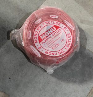 Coiled red plastic tubing wrapped in plastic on a concrete floor, with a circular label reading MONU NO. 1 SUTLEE at the center.