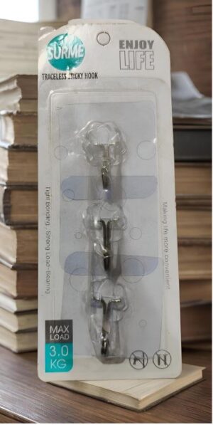 Clear adhesive wall-hanger packaging with three metal hooks, labeled 'Traceless Sticky Hook' and 'Max Load 3.0 kg'