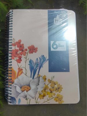 Spiral-bound notebook with a floral cover under plastic wrap, featuring red, yellow, and blue flowers and a blue vertical stripe with a '6 in one' sticker.