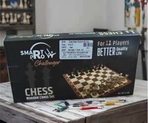 Box for a wooden chess set on a rustic table, showing a chessboard and pieces with text reading 'CHESS Wooden Chess Set' and branding.