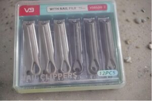 12-piece nail clipper set in a clear plastic case, label reads 'WITH NAIL FILE' and '12PCS' on top