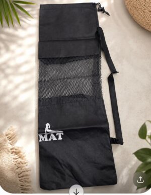 Black roll-up yoga mat bag with a large mesh pocket, a detachable shoulder strap, and a white MAT logo, shown on a light surface.