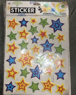 Sheet of colorful star stickers in red, yellow, blue, and green shapes on a light background, ready for decorating.