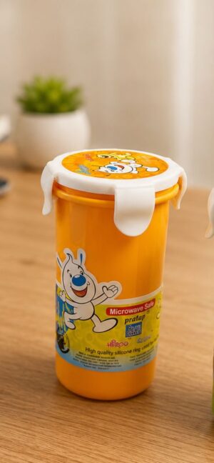 Orange plastic lunch jar with a white flip-top lid, featuring a cartoon rabbit on the label and a microwave-safe note visible on the side.