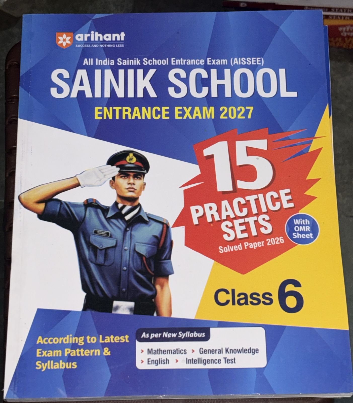 Cover of a Sainik School Entrance Exam 2027 guide with a saluting cadet on the left and bold 15 Practice Sets badge on the right, Class 6
