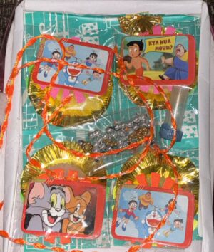 Assorted children's party favors with cartoon cards, orange ribbons, and gold foil wrappers in a gift box/packaging.