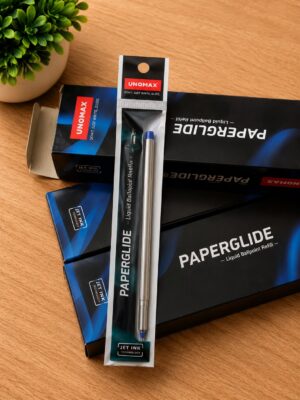 Assorted Paperglide liquid ballpoint refill packaging and Unomax branding on a wooden desk, with a small green plant in the top left corner.