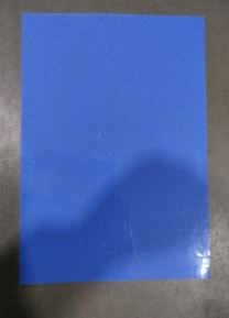 Solid royal blue rectangle on a gray surface (likely a sheet or card).