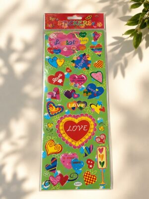 Colorful sticker sheet filled with hearts and love-themed phrases on a green background, packaged for sticking items.