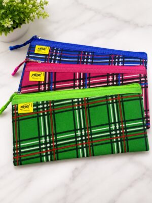 Three plaid pencil pouches in blue, pink, and green stacked on a white marble surface, zippers open-snapped with small yellow brand labels visible.