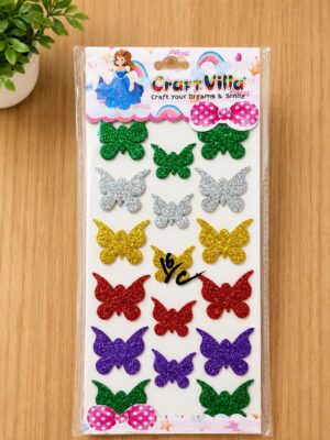 Pack of glitter butterfly stickers in green, silver, gold, red, purple, and teal colors on a white backing card with pink polka-dot bows at the top and bottom, a craft accessory.