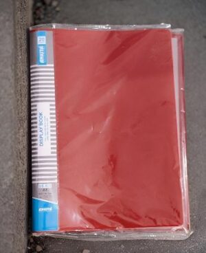Red 20-pocket display book sealed in plastic, with a striped blue-and-white spine on the left.