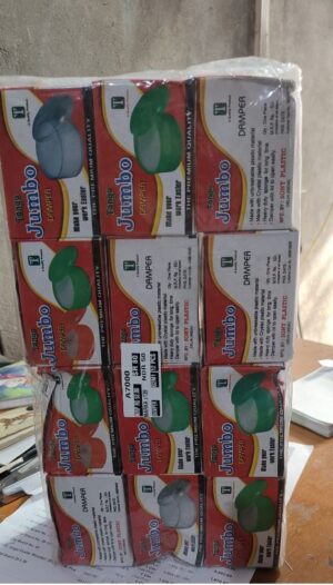 Stack of small cardboard boxes labeled 'Jumbo' and 'Damper' arranged in a 3x4 stack on a table; each box shows an image of a round green or gray plastic damper/sock piece.