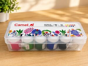 Clear plastic Camel acrylic paint case with a colorful floral lid design, holding 12 pots of 10 ml paint on a wooden table.